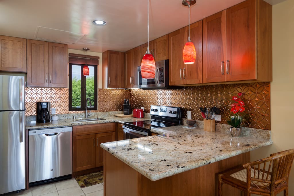 Newer kitchen with granite and stainless steel appliances