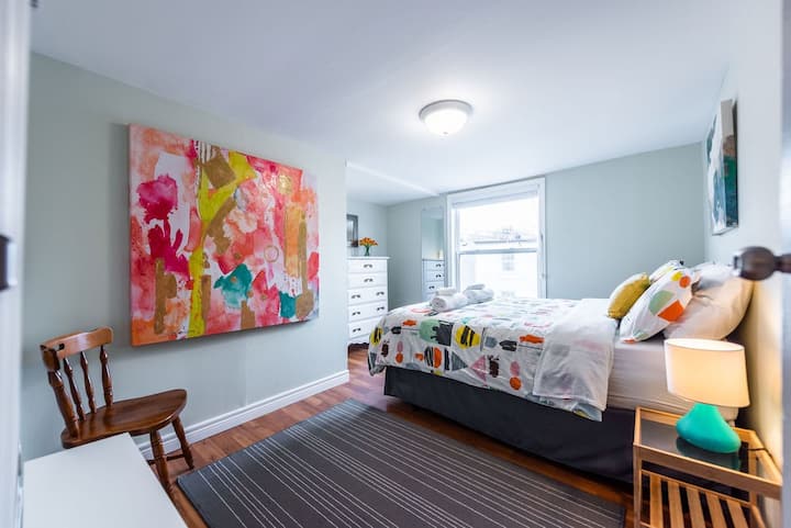This bedroom at the front of the house also features a great view of Cabot Tower atop Signal Hill.