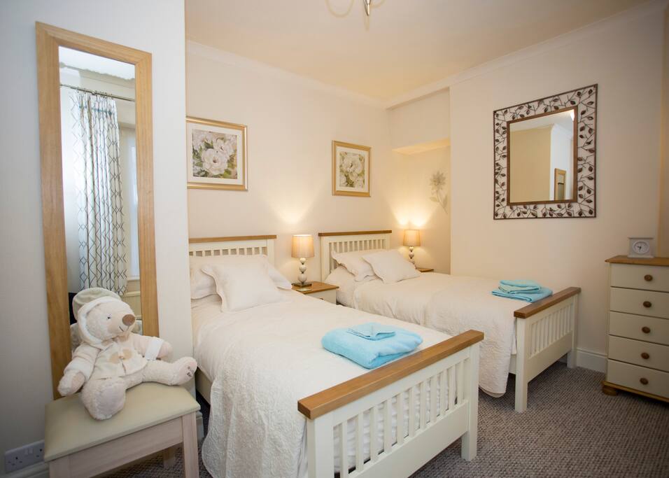 Cosy twin bedroom with resident teddy bear Freddy