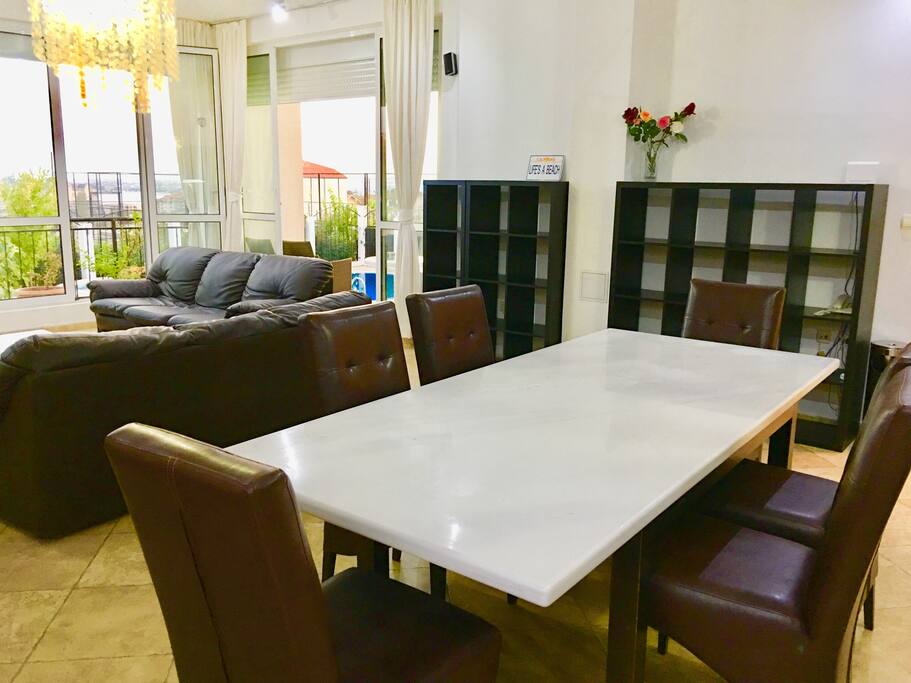 This is the largest dining table in the open space kitchen/ dining room.