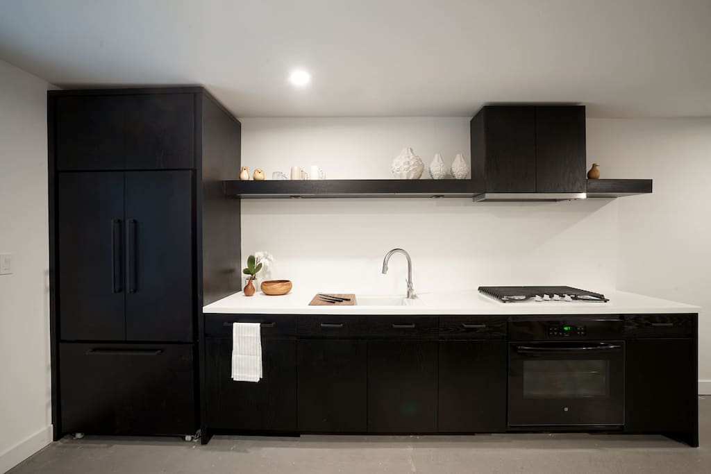 Kitchen - paneled dishwasher and fridge