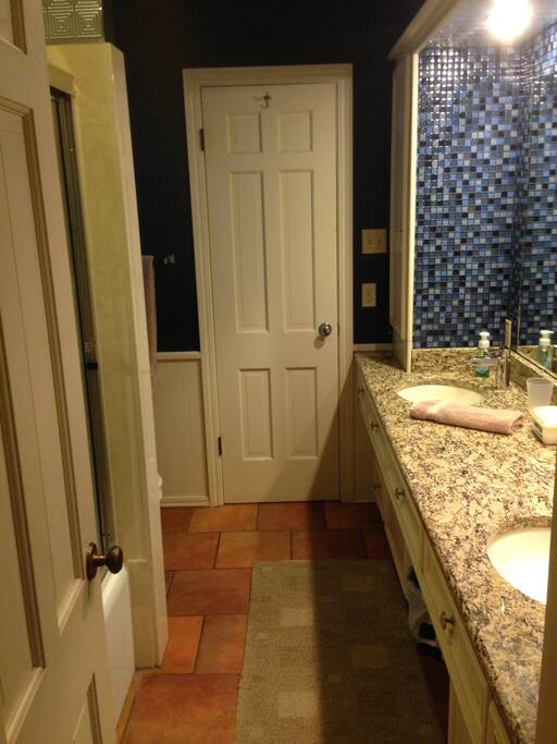 Full bath with double vanities, tub-shower combo