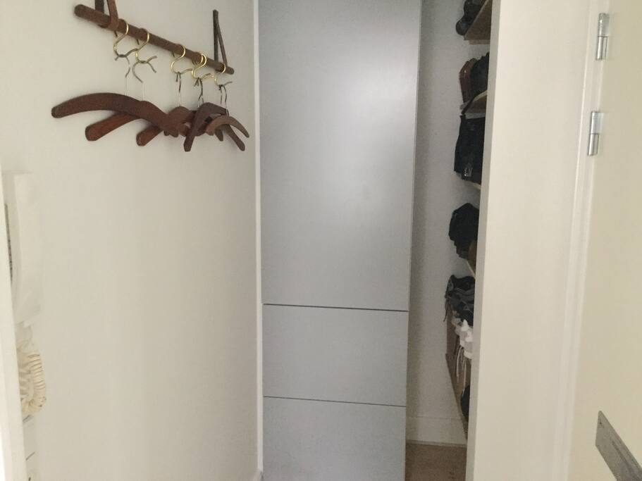The tiny hall for shoes and jackets.
