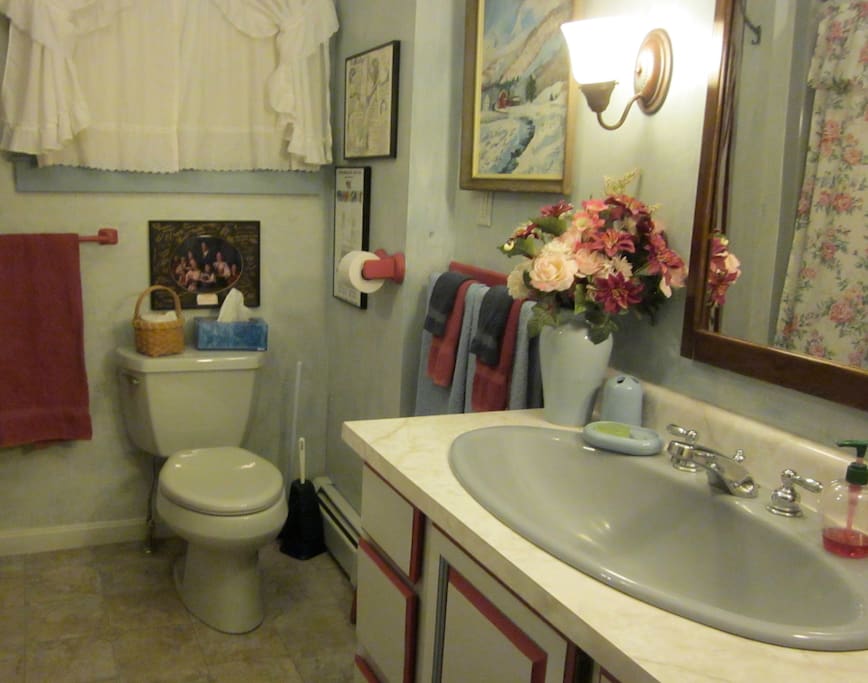 The Parlor bathroom has a large tub with shower & a tub chair for those who need easy access.