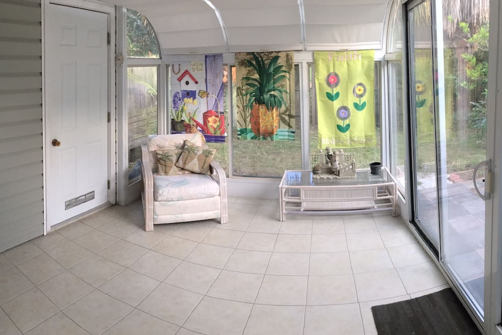 Beautiful sunroom open to private backyard