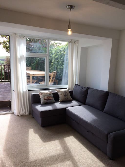 Lounge with sofa that turns into a large double sofa bed