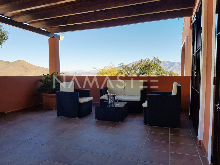 Patio by the kitchen with mountain view