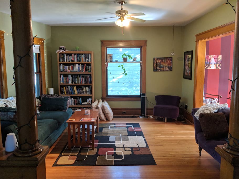 Plenty of couch and chair space for lounging, and a lending library you're welcome to use while you're here!