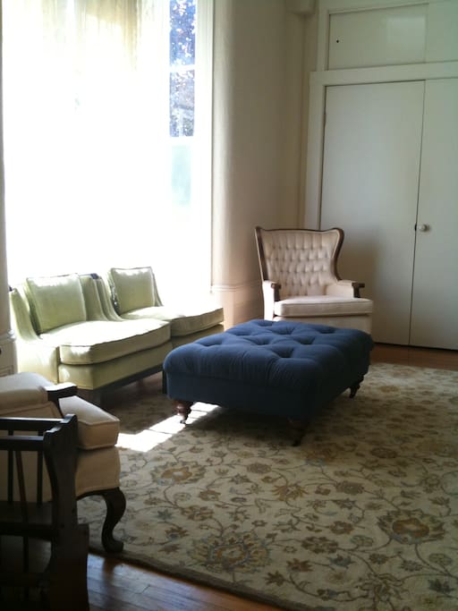 Main parlor has comfortable seating and flat screen TV.