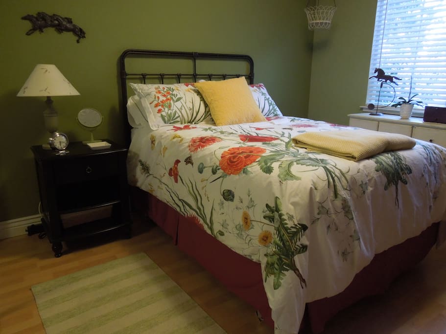Cheery front bedroom features double bed, large closet and dresser.