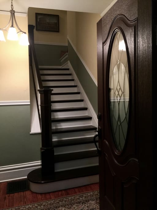Main entrance, and stairs that lead to Guest Room.