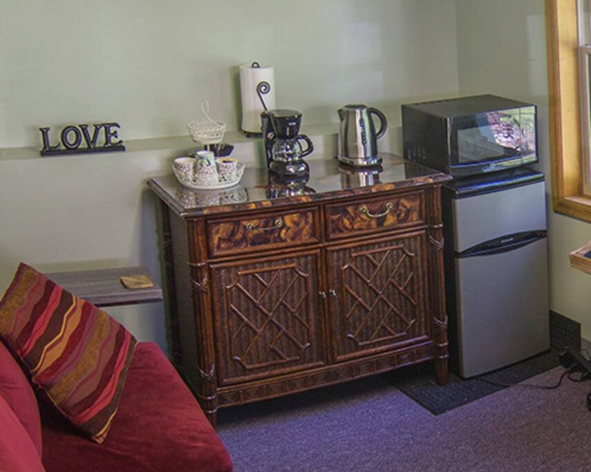 Cafe has fridge, microwave, coffee pot, hot pot, plenty of plates & utensils, water and more.