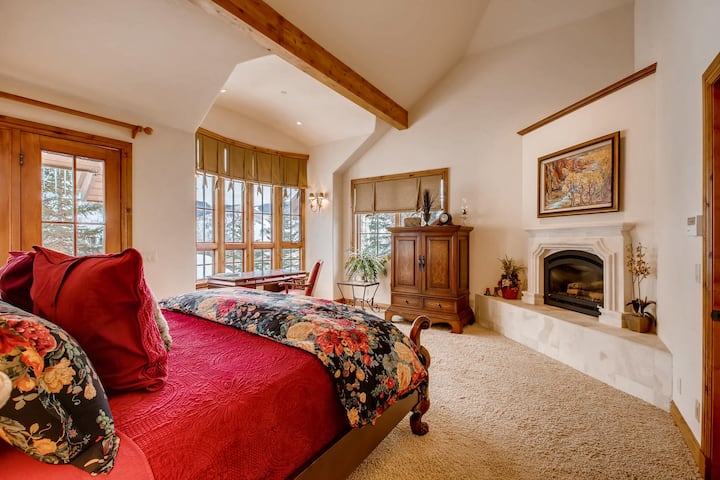 Master Bedroom + Fireplace with Private Deck