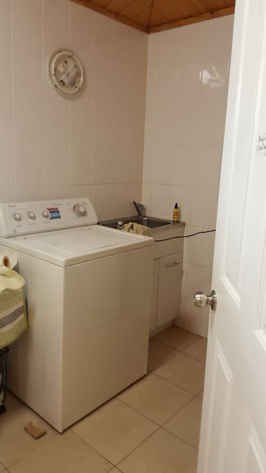 Combined bathroom/laundry with washer and dryer