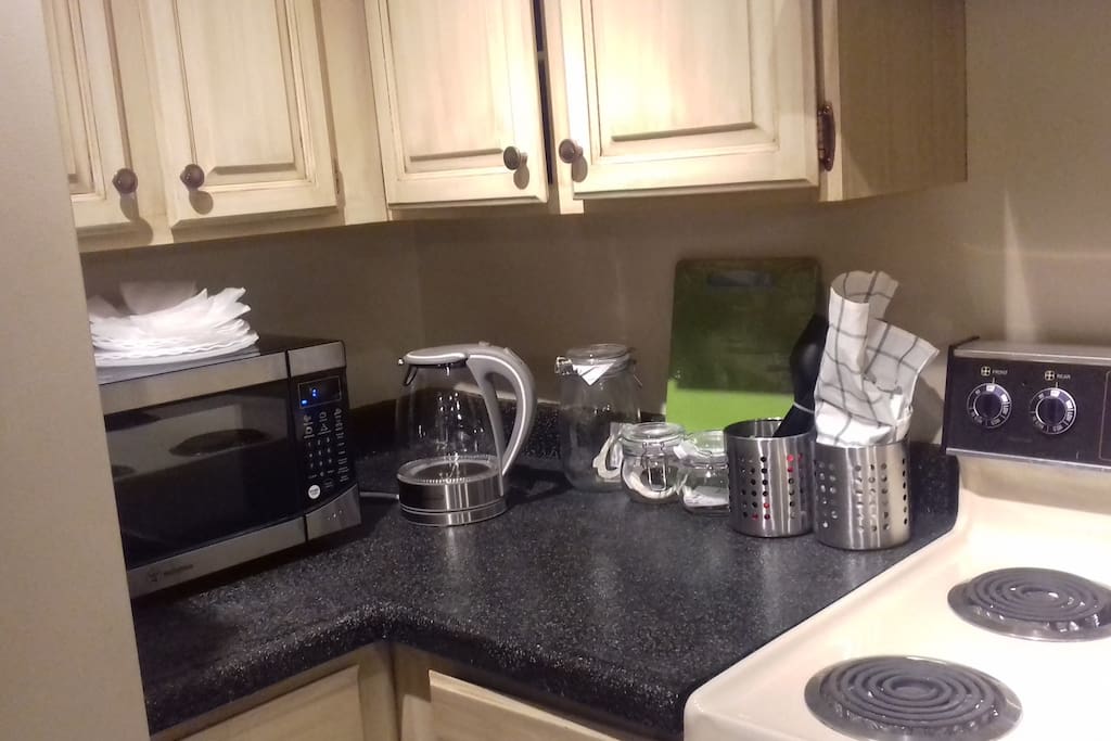 A few basic kitchen appliances like a microwave, electric hot water kettle, and keurig coffee maker.