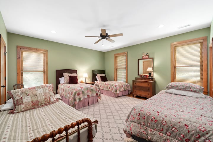 Upstairs bedroom #2 - two extra long twin beds, one standard twin, and a crib (replaced day bed; not yet pictured)