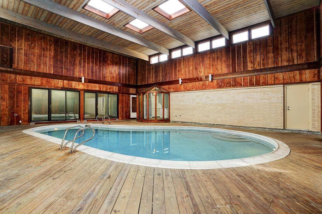 Indoor pool in the middle of the house with pool heater
