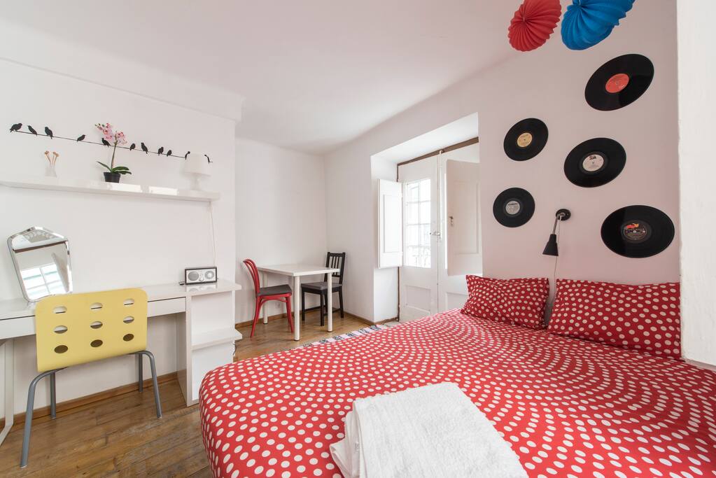 Bedroom with working desk and table for two