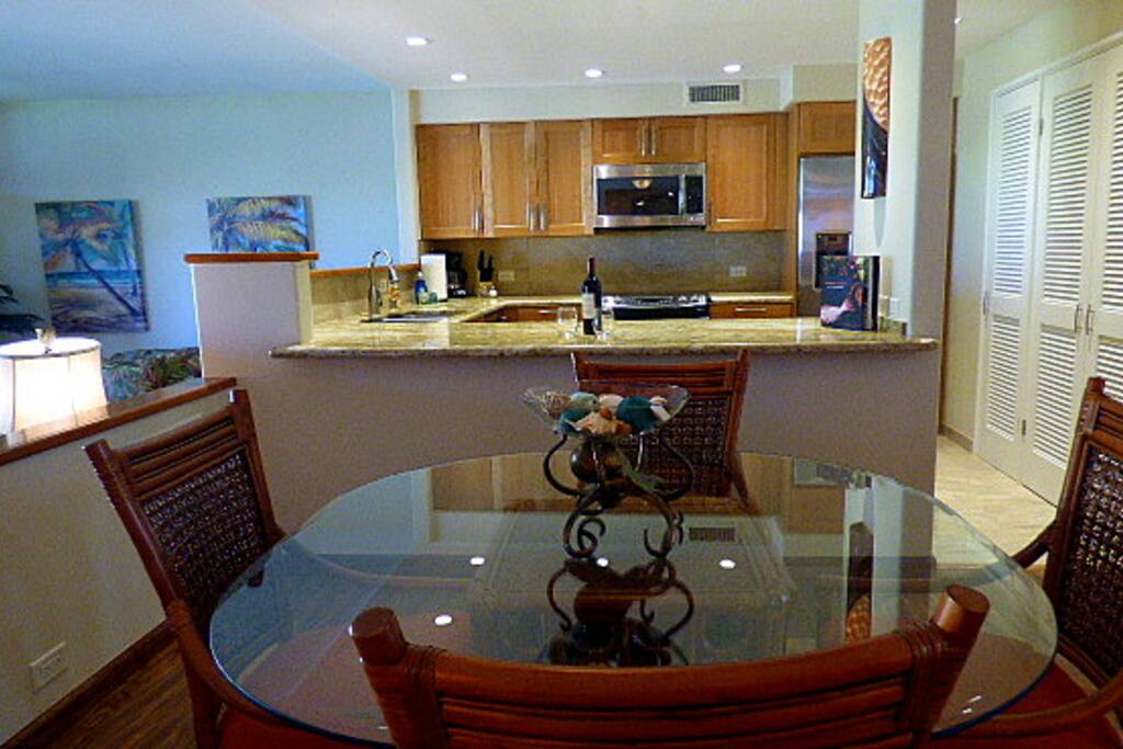 Upgraded kitchen with granite countertops and stainless steel appliances.