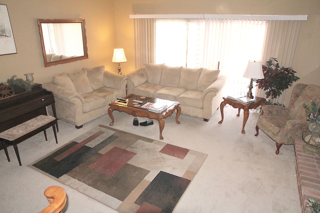 A nice sunken living room to relax with cable TV.