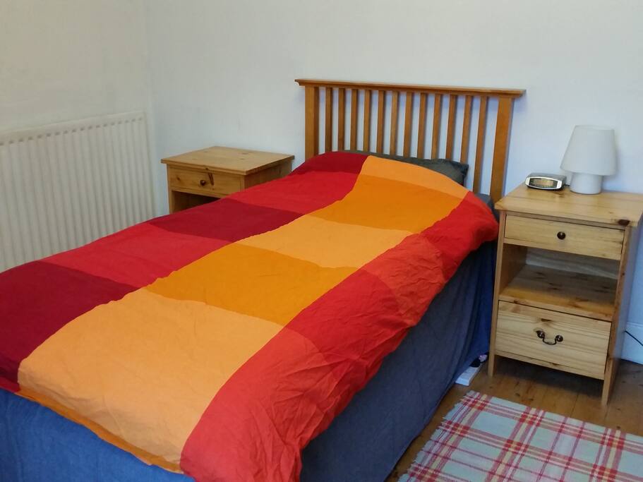 Single bed set up (the other one is stored underneath). reasonably sized bedroom.
