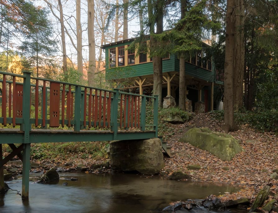 Bridge leads from trails to the cottage