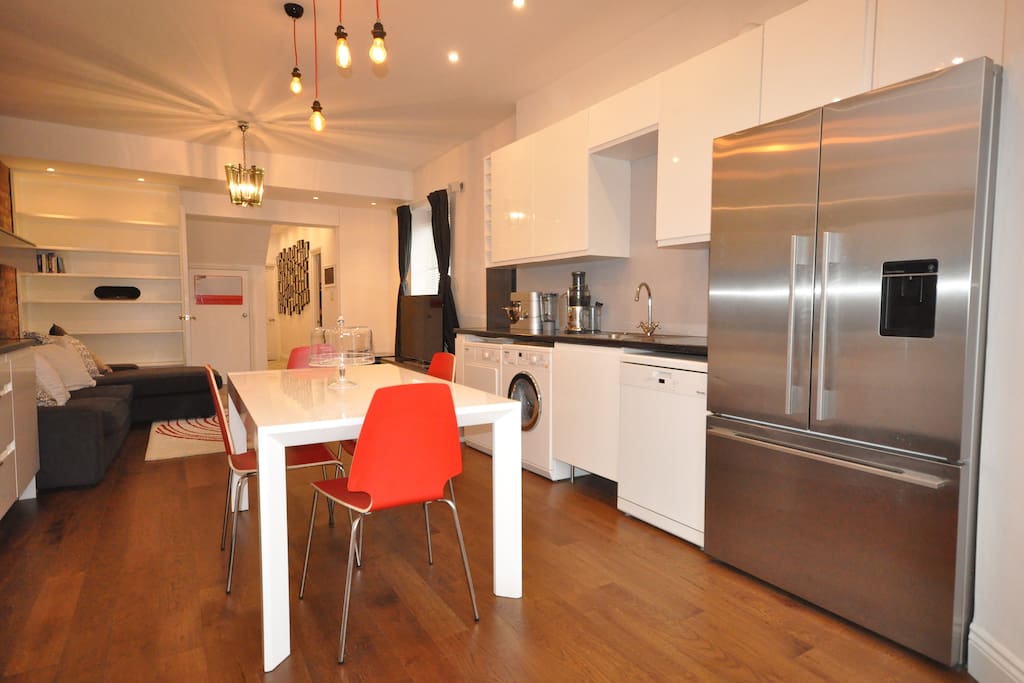 Open plan kitchen and living space with large fridge freezer