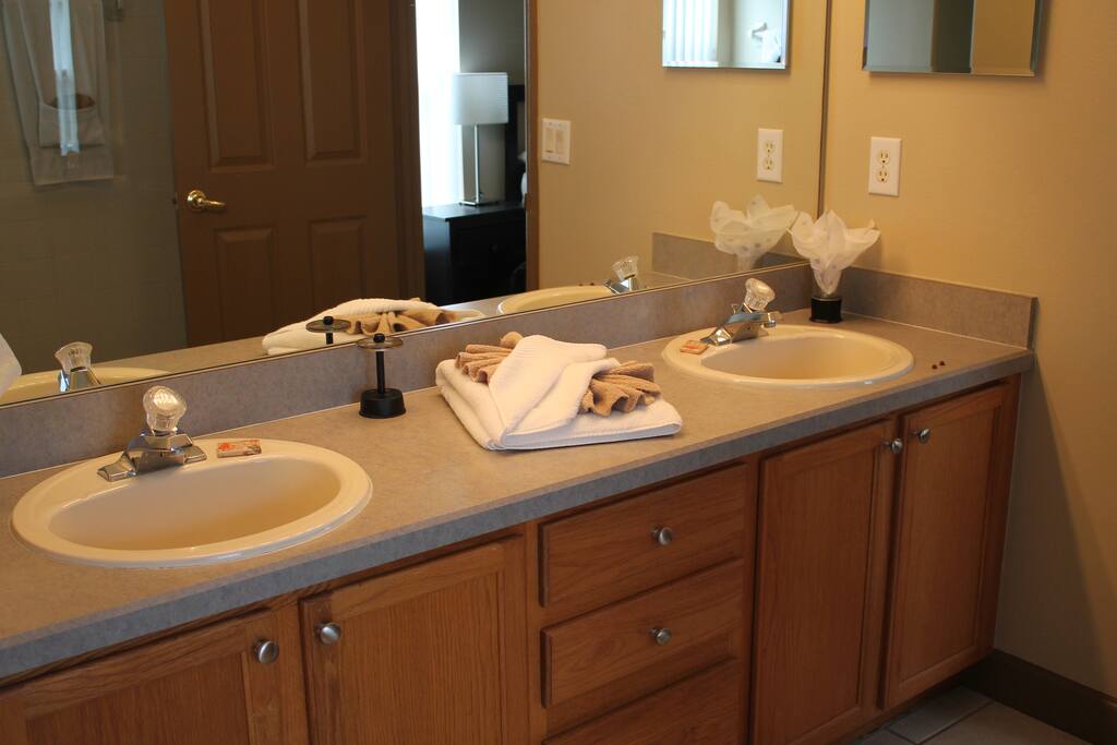 Master ensuite bathroom with stand alone shower and seperate soaker tub, and separate entrance to pool/spa patio