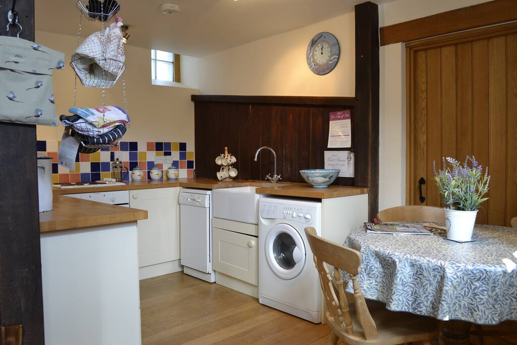 Well equipped kitchen dining area with dishwasher.