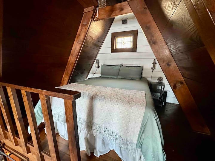 Main bed is in the upstairs loft. Memory foam queen bed