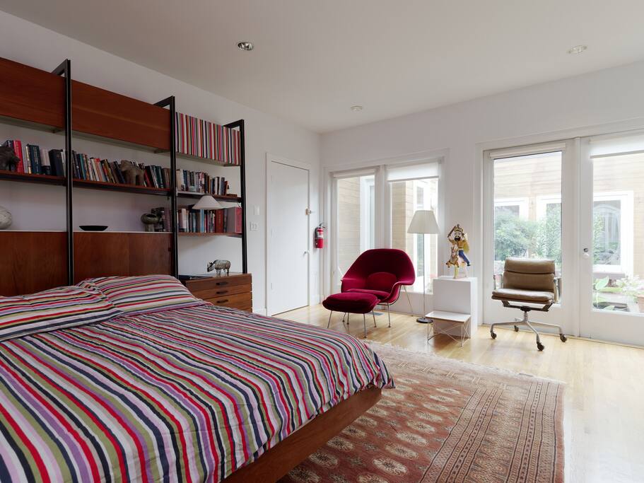 The bedroom looks out to a courtyard