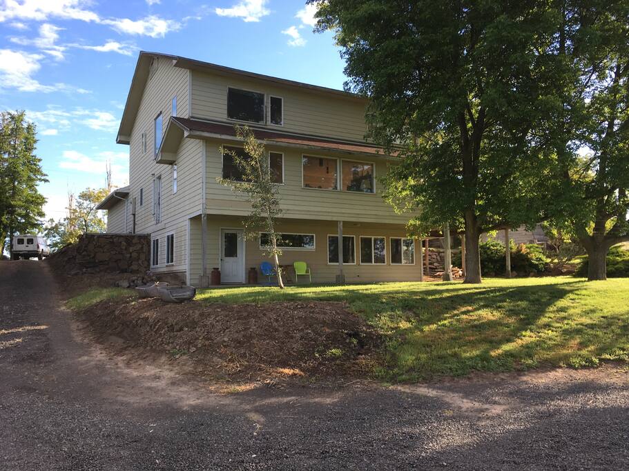 Private driveway and parking area behind house.
