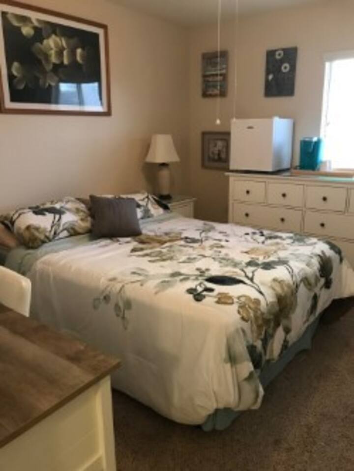 View Of Bedroom Shows Mini Fridge And Keurig Coffee Maker