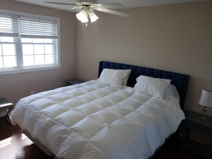 Bedroom 1 upper level king size looking out to lake.