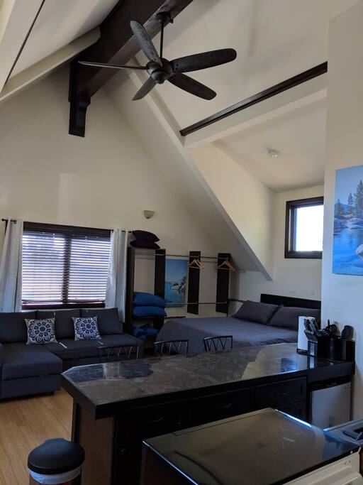 High-vaulted ceilings make this already large studio feel even more spacious. A Cal-King bed with brand new memory foam mattress and Ikea sofa that easily converts into a queen size bed with comfortable topper for additional guests.
