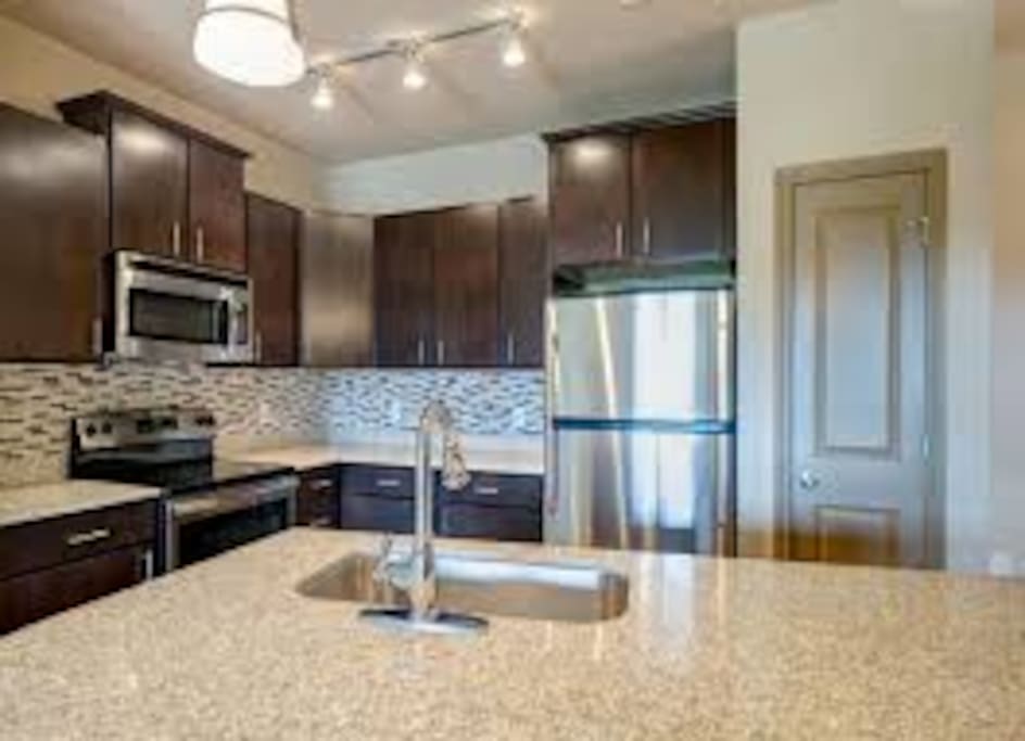 Large kitchen with brand new appliances, so you can cook up a great meal.