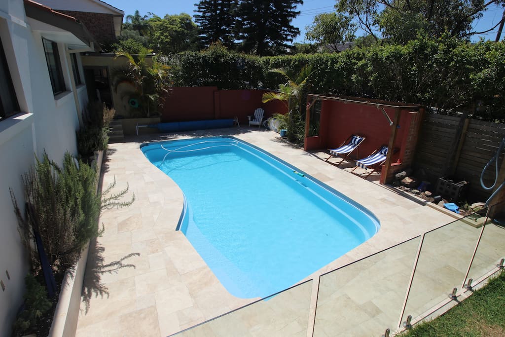 Travertine tiling around the pool area, relax in the deck chairs or go for a swim!