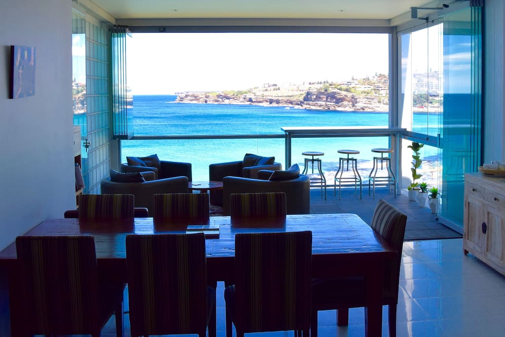 Open plan living, dining and kitchen, all enjoying the stunning ocean views.