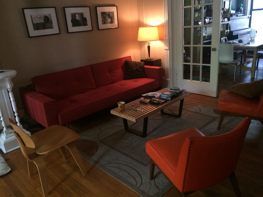 Living room with cozy seating and large TV available for guest's use