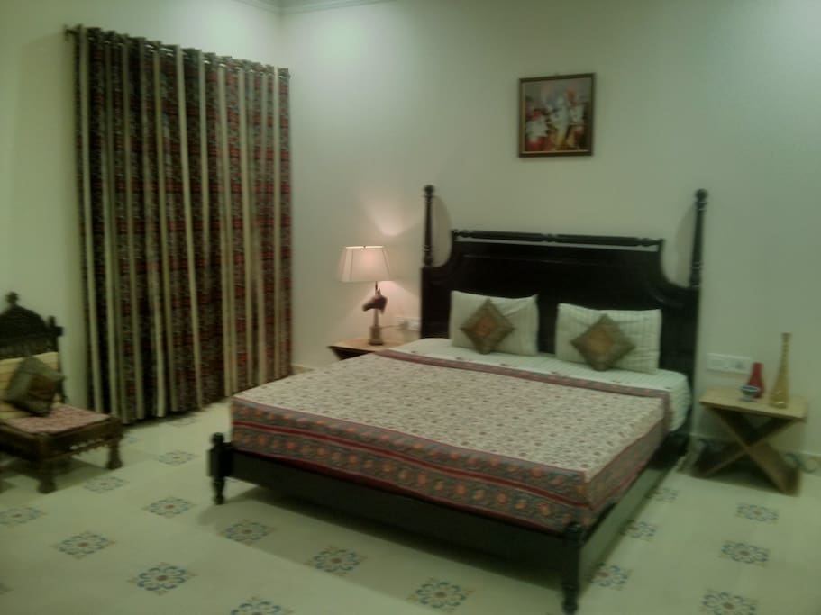 Spacious bedroom with ethnic linen
