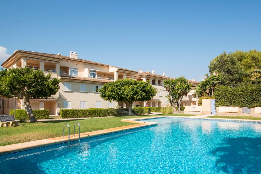 Relax in the communal gardens and pool.