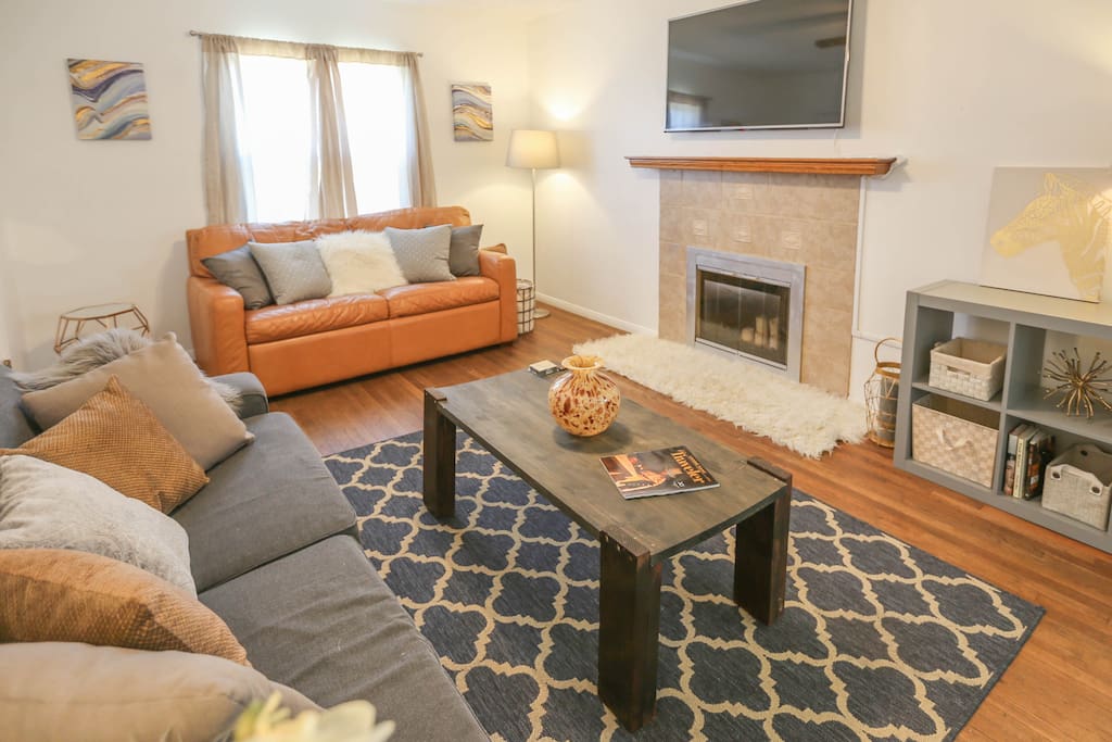 Living room great for relaxing with two couches (brown leather couch is a pullout with a very comfortable bed). HD 4K TV with Netflix & Amazon Prime