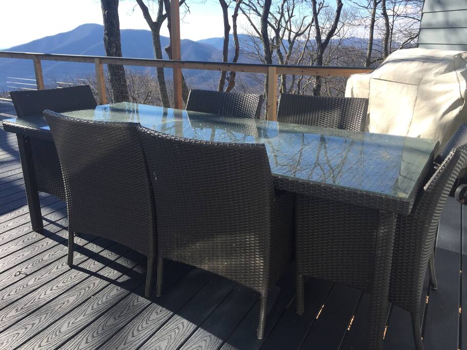 Deck with grill, table/chairs and adirondack chairs to enjoy the view.