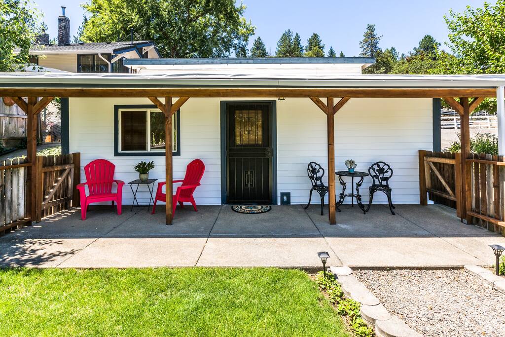 Front of cottage with fenced and private yard and... nice covered front porch.