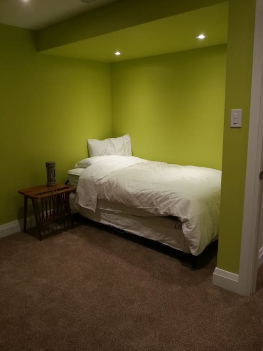 One of the 2 Beds in this room the 2nd bed pulls out and up to the same height as this bed