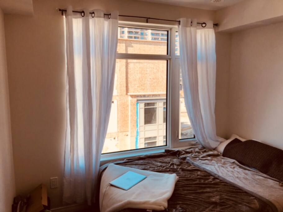 Bright, sunny bedroom with double bed