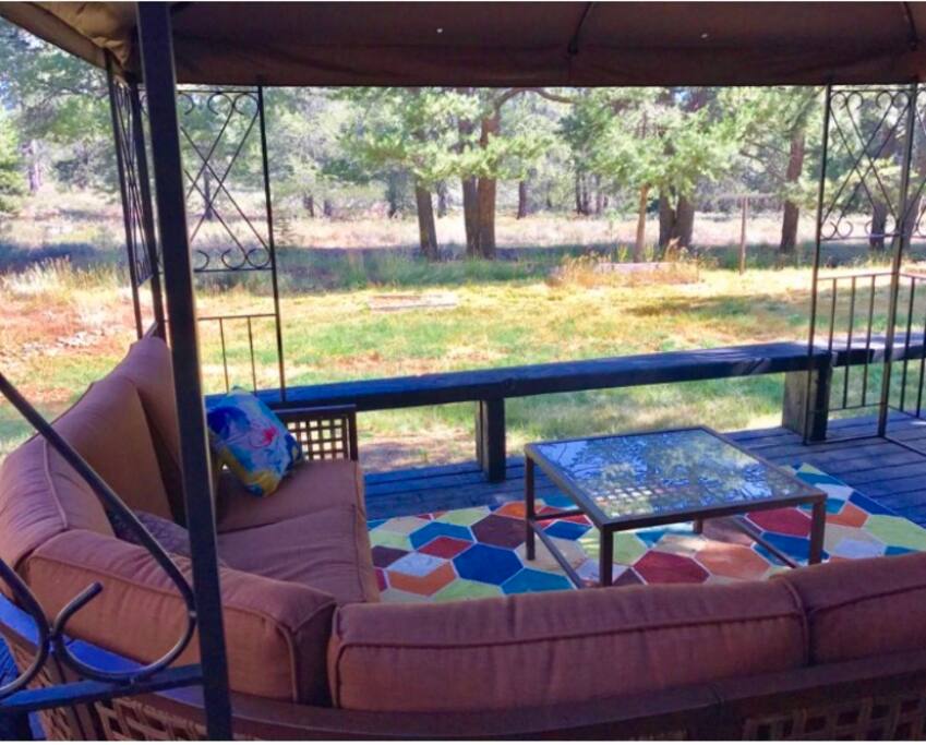 Our outdoor dining area with views of the forest and meadows!