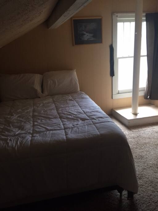 This is bedroom number 3 upstairs with a queen size bed
