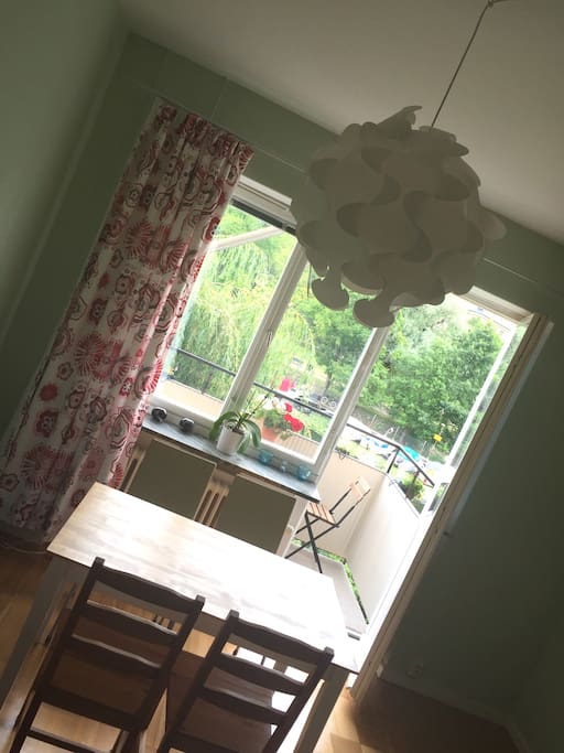 Living room dining corner opening towards the beautiful balcony.