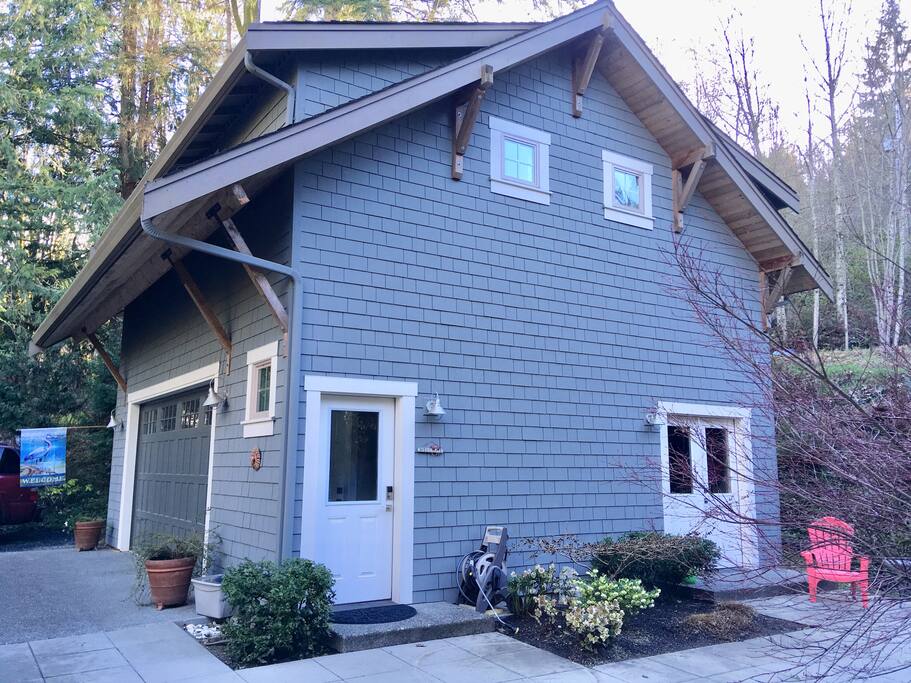 Entry to the Heron’s Nest is on the left. In the summer months, relax outside on the patio in the red Adirondack chairs.
